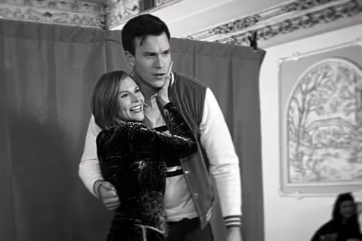 Black and white — holding a scene partner in a beaded gown in an ornate interior
