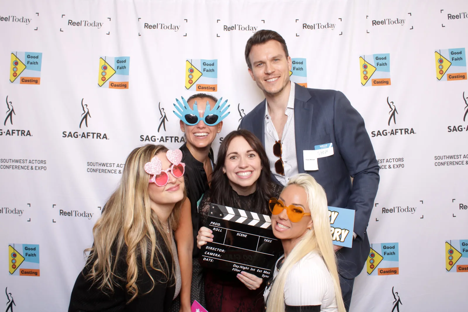 At a SAG-AFTRA event, posing with a clapperboard at the step and repeat