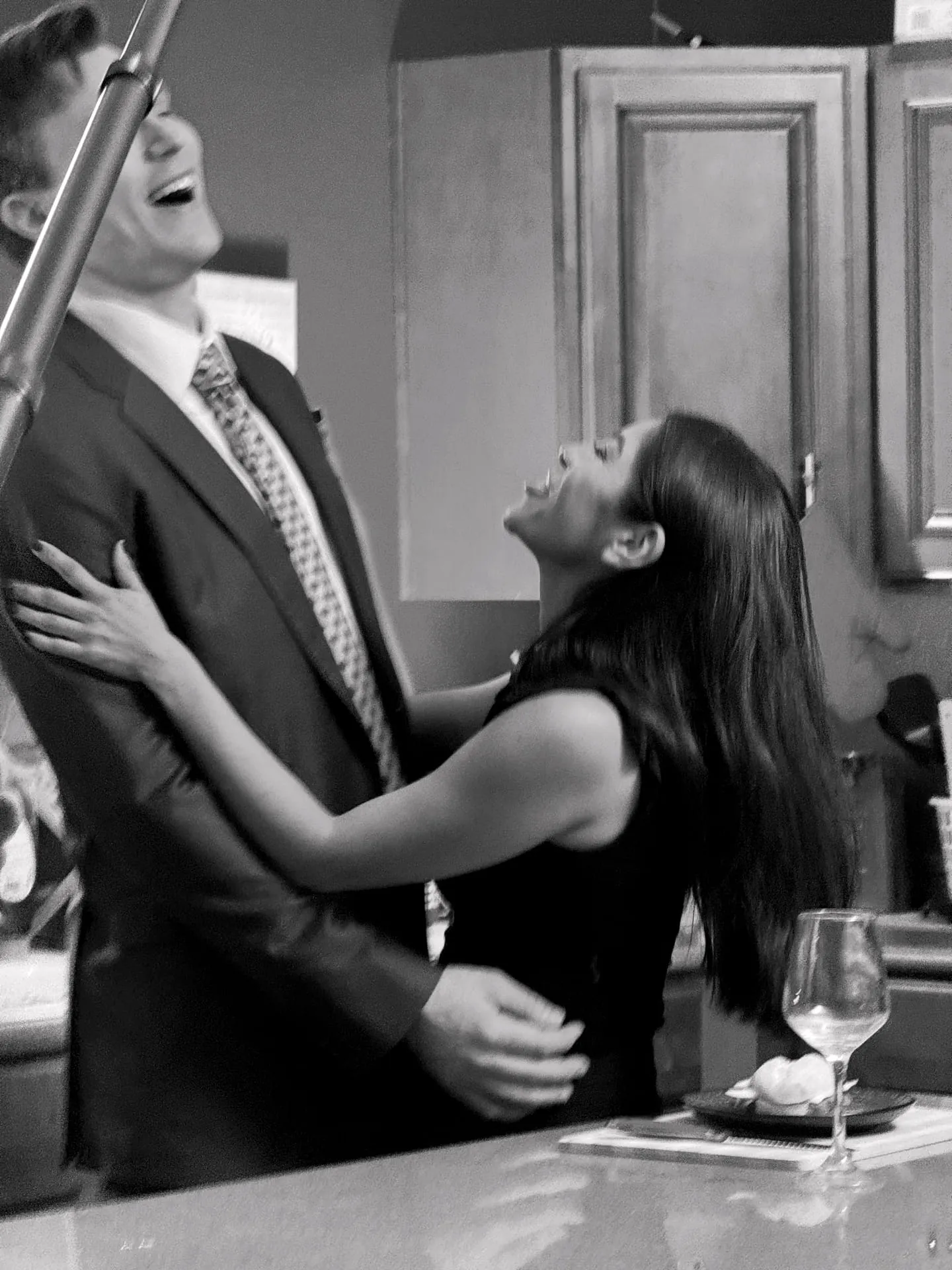 Or Death, behind the scenes — mid-scene with a scene partner beside the counter
