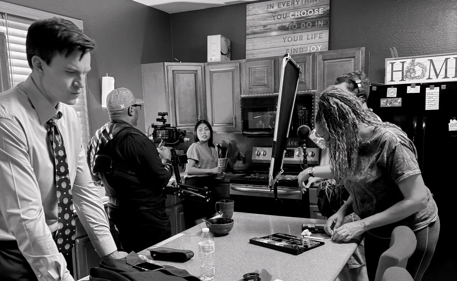 Or Death, behind the scenes — crew working around the actors on the kitchen set