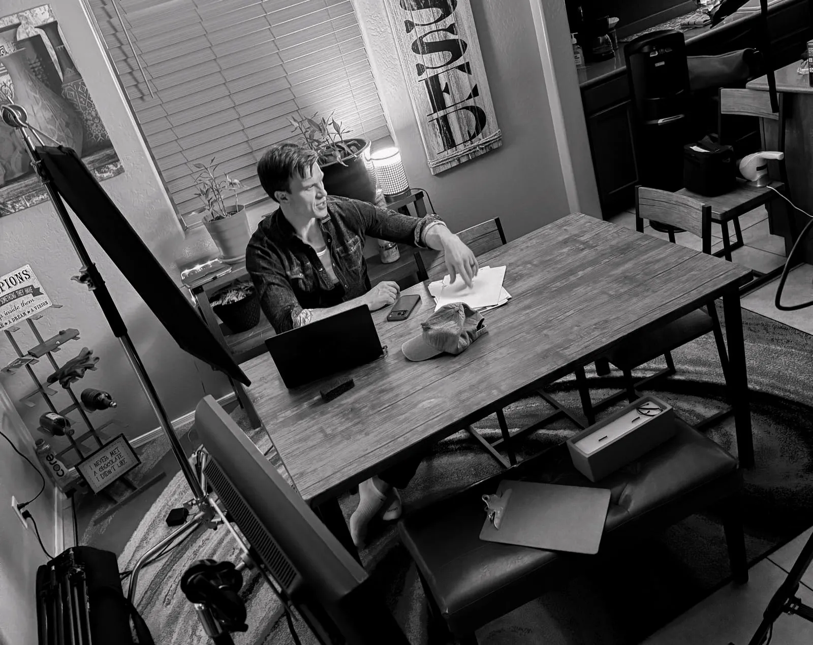 Or Death, behind the scenes — the dining table setup, lit and empty between takes
