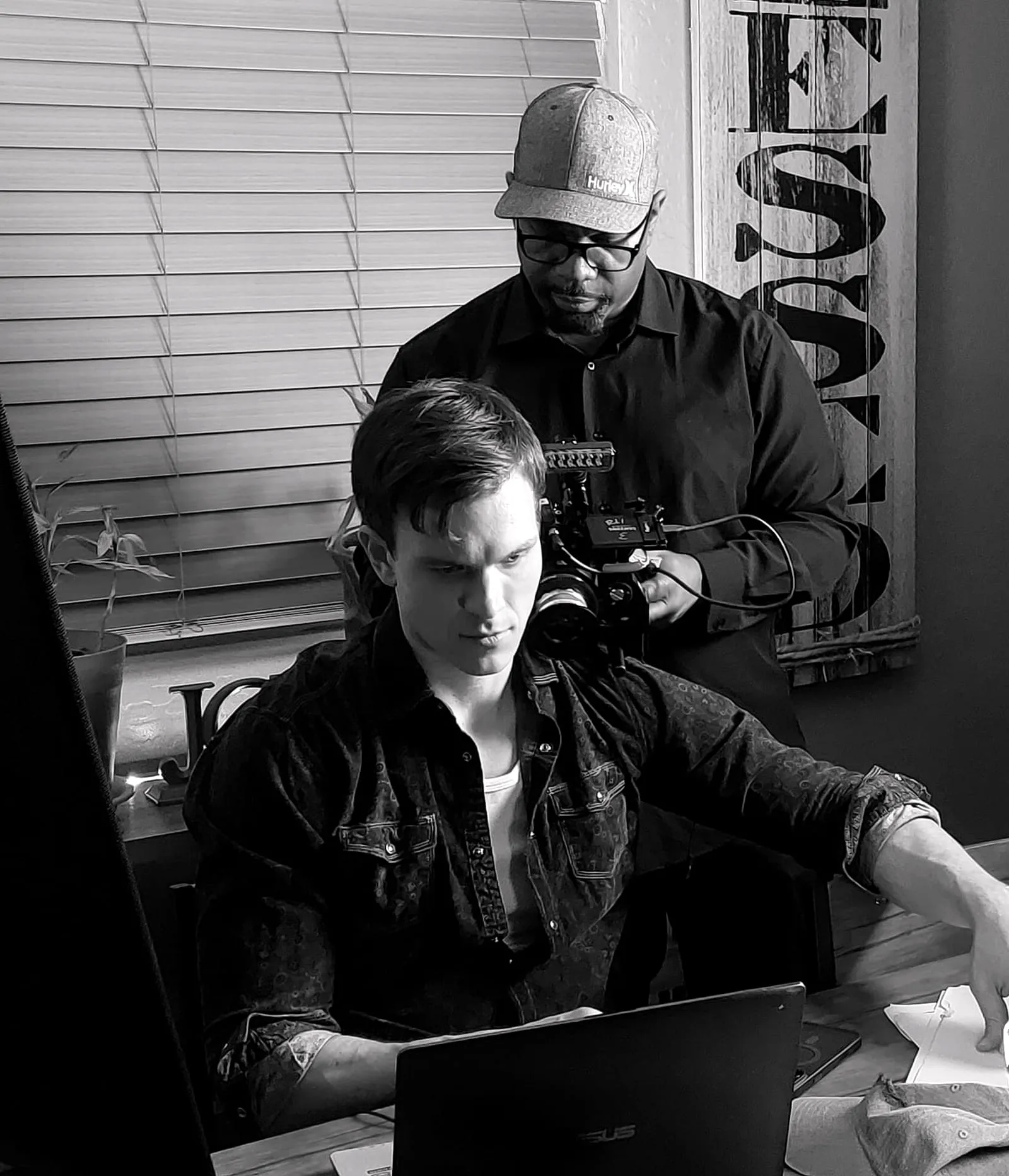 Or Death, behind the scenes — at a laptop while the operator frames over his shoulder