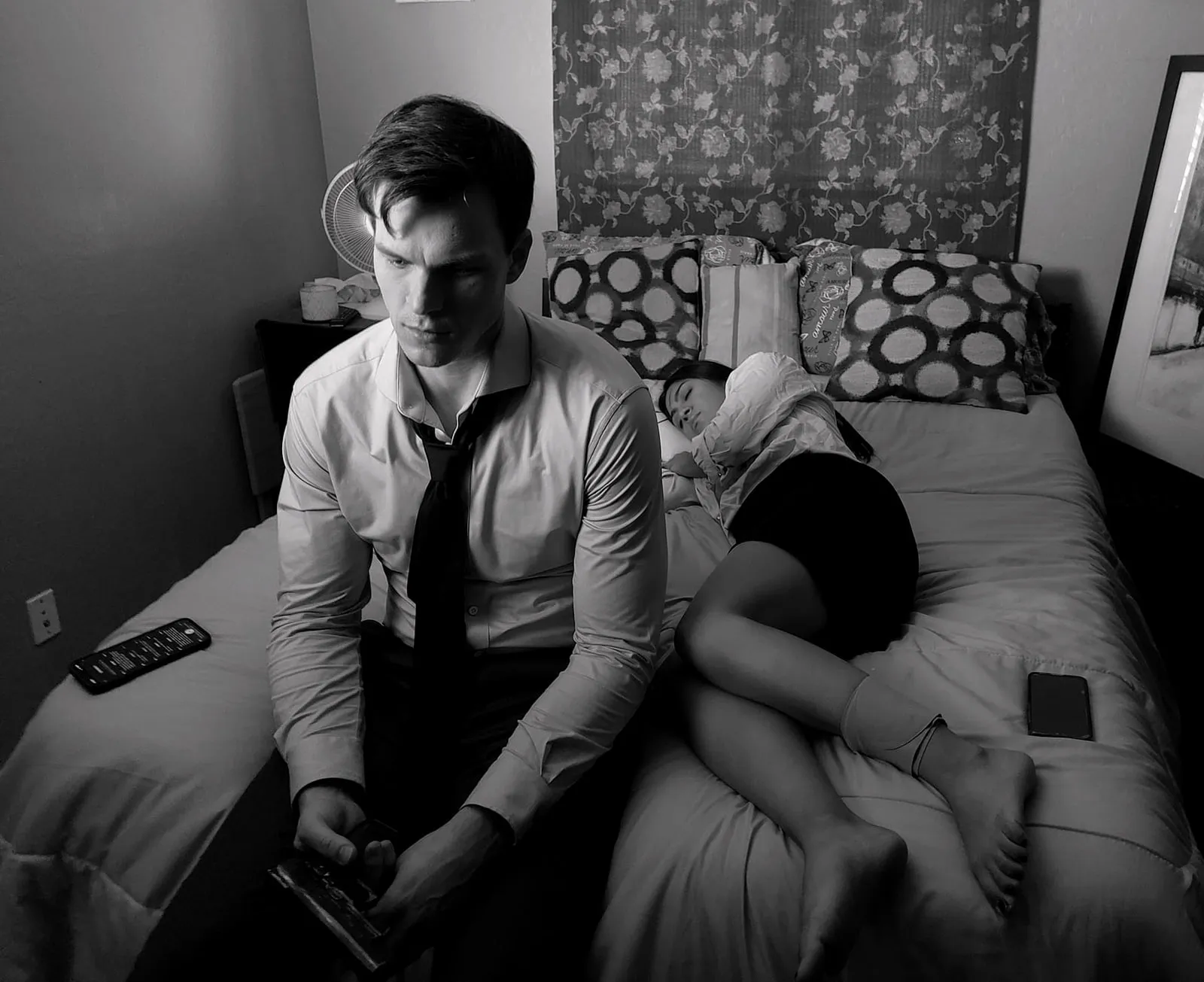 Or Death, behind the scenes — seated on the edge of the bed, a scene partner behind